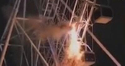 Ferris wheel bursts into flames with 62 people trapped in New Year's Eve horror