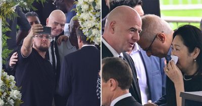 FIFA president Gianni Infantino poses for selfie next to Pele's open coffin