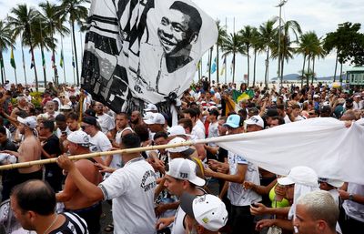 Pele to be buried today after lying in state as thousands of fans queue to pay tribute