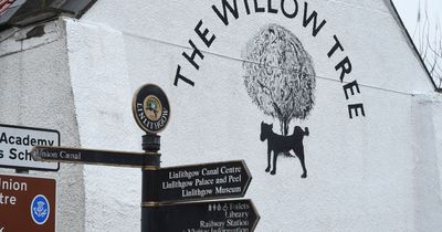 Linlithgow locals left in hysterics after mystery artwork of dog peeing on new pub sign appears