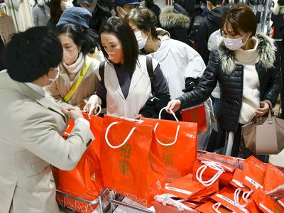 Customers return to department stores for New Year's sales