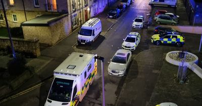 Edinburgh police lock down street after 'stabbing' as man rushed to hospital