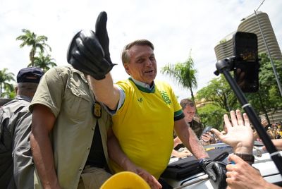 Photo of Bolsonaro eating KFC in Florida after Brazil election loss inspires memes – and even an oil painting