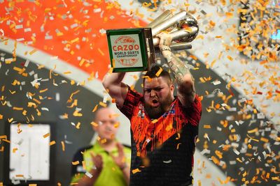 Michael Smith throws nine-darter to win first World Championship after thrilling final