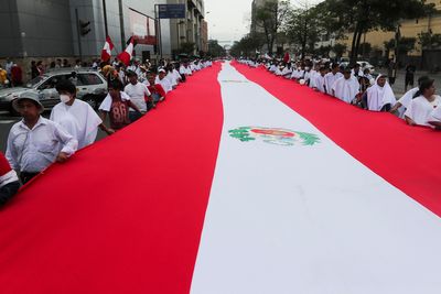 Conservative Peruvian groups march for peace ahead of fresh protests