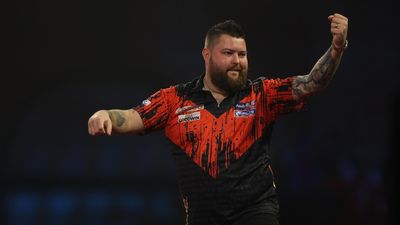 England's Michael Smith hits a nine-dart finish on the way to the PDC world darts title, beating Michael van Gerwen