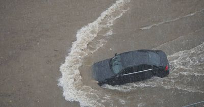 Homes and businesses inundated after flash flood hits Canberra