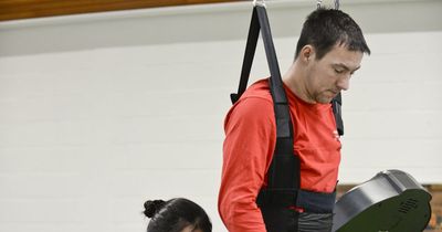 Robotic therapy helps keep paralysed dad's dream alive to walk daughters down the aisle