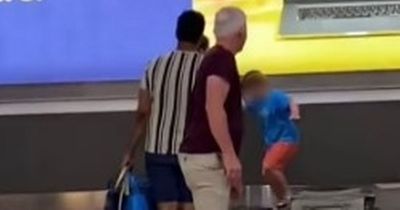 Unruly child 'throws luggage' and wreaks havoc at busy airport baggage carousel