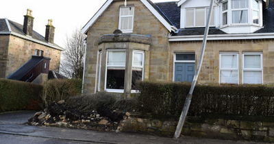 Glasgow-bound bus crashes into garden wall causing debris and damage on pavement