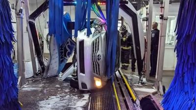 Security Video Captures Moment Runaway Car Flips Inside Car Wash
