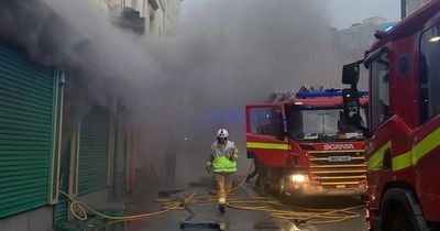 Flat mates wake up to thick black smoke as fire engulfs pharmacy