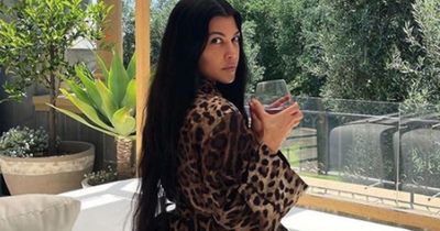 Kourtney Kardashian praised for showing off 'beautiful' real curves in leopard-print robe