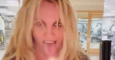 Britney Spears holds lighter to her tongue as she dances to JLo song in bizarre video