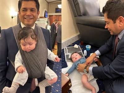 Democratic congressman Jimmy Gomez wears baby in carrier during House speaker votes