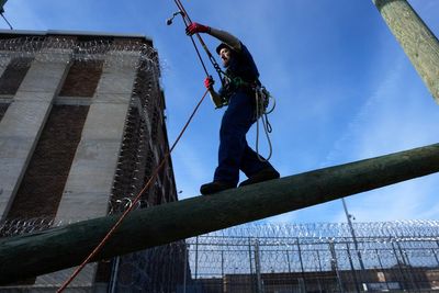 Michigan program trains prisoners to trim around power lines