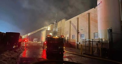 Firefighters up to their knees in river of butter after huge fire at dairy factory