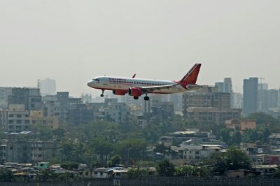 Police arrest Indian executive for urinating on plane passenger