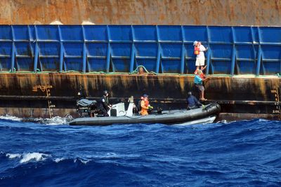 Warship rescues crew of sinking tug in the Caribbean