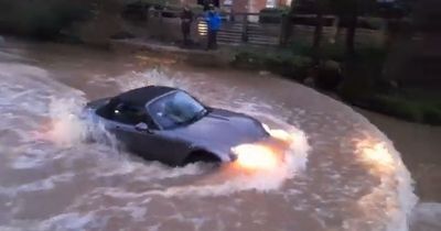 Historic ford is closed as Tiktok craze sees hundreds flock to watch cars stuck in floods
