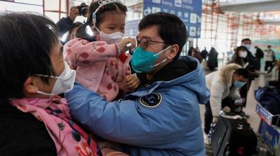 China Ends Quarantine for Overseas Travelers