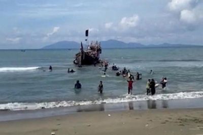 Boat with 185 Rohingya refugees lands in Indonesia's Aceh