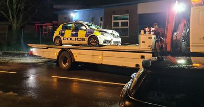 Crumpled police car removed from Greater Manchester junction following crash