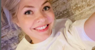 'Brave' Holly Willoughby fiercely defended as she lets son, 8, loose on hair with scissors
