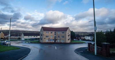 Block of flats built in the middle of a roundabout leaves families surrounded by traffic