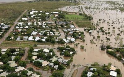 PM tours another flood zone as storm clouds gather on carbon cuts