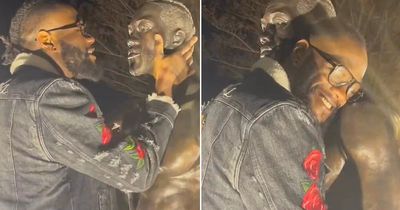 Deontay Wilder hugs and talks to his own statue as he tells it "you look good"