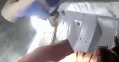 Russian plane door flies open as passengers' bags sucked out in horror flight footage