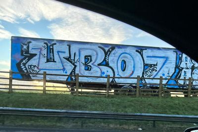 Alba Party billboard covered up with Rangers ultras graffiti