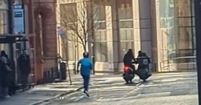 Moment Deliveroo driver chases thief down the street after scooter stolen outside Manchester McDonald's
