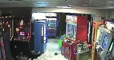 Terrifying CCTV shows moment huge wave smashes through UK arcade after heavy rain