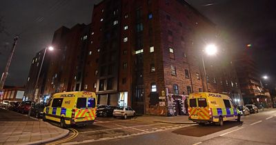 Police surround flats after man 'takes gun to bar'