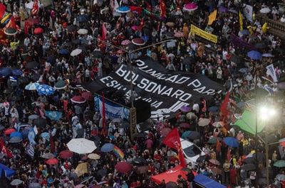 Thousands in Brazil demand Jair Bolsonaro be jailed for ‘supporting far-right rioters who tried to seize capital’