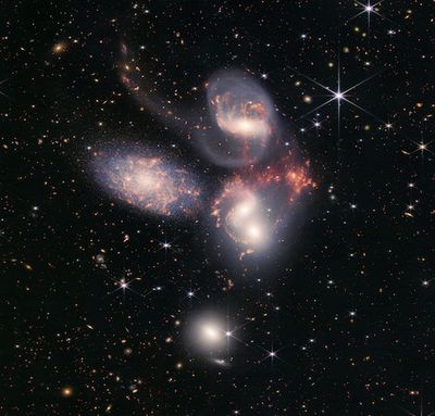 JWST images turn up galaxy-sized sonic booms disrupting gas clouds in distant cluster