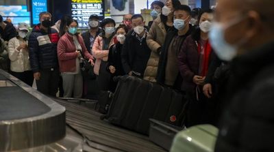 WHO Urges Travelers to Wear Masks as New COVID Variant Spreads