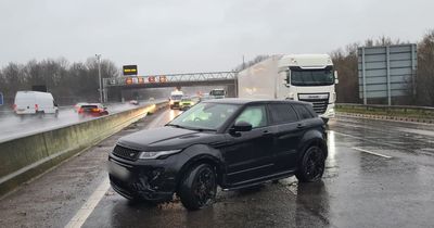 Aftermath of Range Rover crash on M1 near junction 28 in warning over 'standing water'