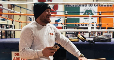 Conor McGregor poses in rare custom clothes back where it all began