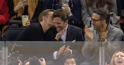 Ryan Reynolds, Alexander Skarsgard gave Henrik Lundqvist some delightful smooches during Rangers game