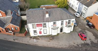 Former pub with Liverpool and Everton crests on the walls for sale