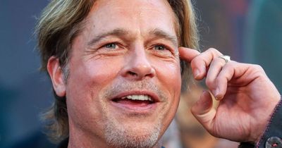 Brad Pitt shows off dazzling new look at Golden Globes after fixing his chipped teeth