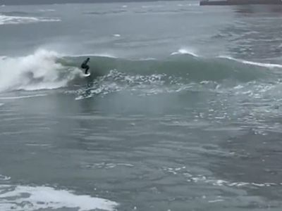 California surfers making the most of huge waves generated by ‘50-year storm’