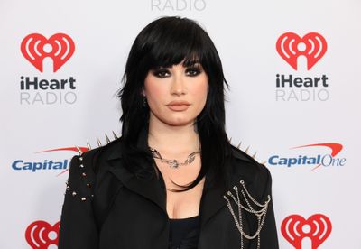 Demi Lovato bondage-and-crucifix poster banned in the U.K. for offending Christians