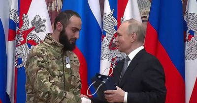 Vladimir Putin awards armed robber with 'courage' honour for fighting in Ukraine