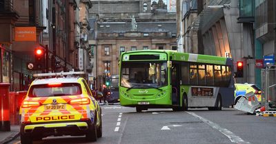 Woman rushed to hospital after being 'trapped under bus' in Scots city centre