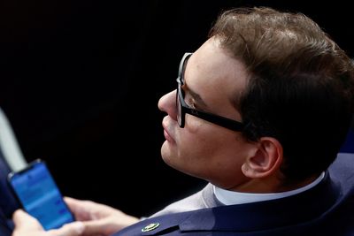 Embattled George Santos defies New York Republicans' call to step down