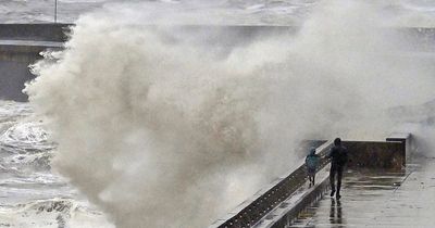 Terrifying moment kid is inches away from huge wave as heavy rain continues across UK